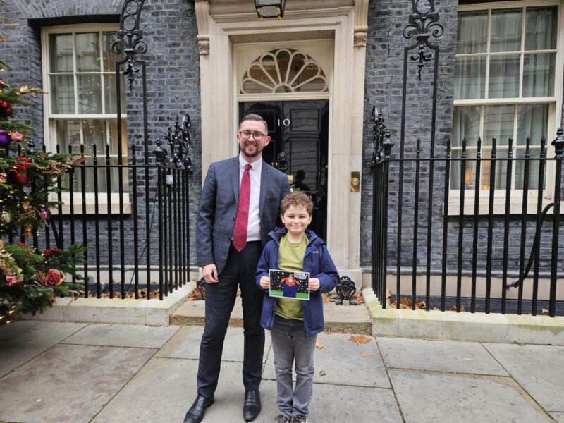Connor Naismith MP with the 2025 Christmas Card winner at No 10.